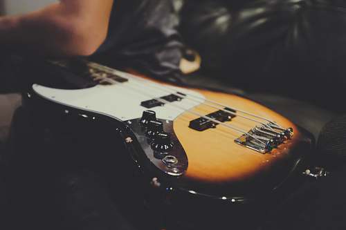leisure activities white and brown guitar close-up photography musical instrument